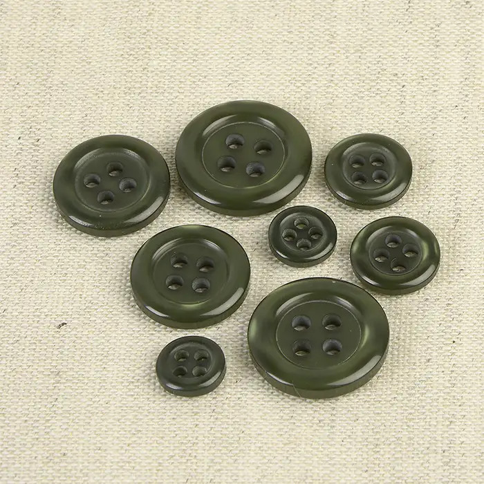 Bouton rond 4 trous vert 9mm (à l'unité) Bouton rond 4 trous vert 9mm (à l'unité)